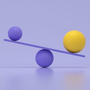 Seesaw balance concept representing adaptability in leadership and IDI leadership development.