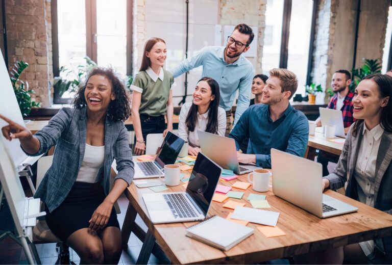 Leadership team collaborating in a workplace meeting discussing communication and team dynamics